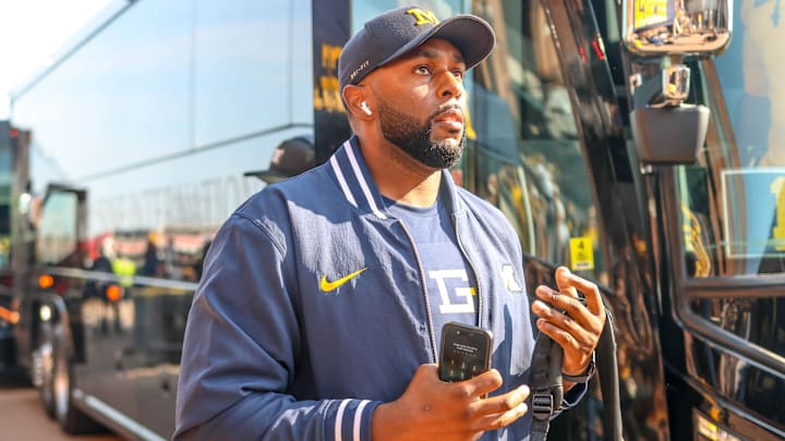 Michigan football head coach Sherrone Moore, players honor the memory of athletic counselor Greg Harden with t-shirts, hats and helmet decals for Saturday's game vs. Arkansas State.