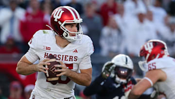 Nov 8, 2025; University Park, Pennsylvania, USA; Indiana Hoosiers quarterback Fernando Mendoza (15) runs with the ball during the fourth quarter against the Penn State Nittany Lions at Beaver Stadium. Mandatory Credit: Matthew O'Haren-Imagn Images