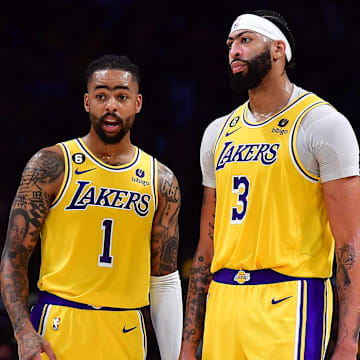 Apr 24, 2023; Los Angeles, California, USA; Los Angeles Lakers guard D'Angelo Russell (1) speaks with forward Anthony Davis (3) against the Memphis Grizzlies during the second half in game four of the 2023 NBA playoffs at Crypto.com Arena. Mandatory Credit: Gary A. Vasquez-Imagn Images