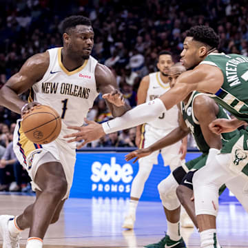 Mar 28, 2024; New Orleans, Louisiana, USA;  New Orleans Pelicans forward Zion Williamson (1) dribbles against Milwaukee Bucks forward Giannis Antetokounmpo (34) during the second half at Smoothie King Center. Mandatory Credit: Stephen Lew-Imagn Images