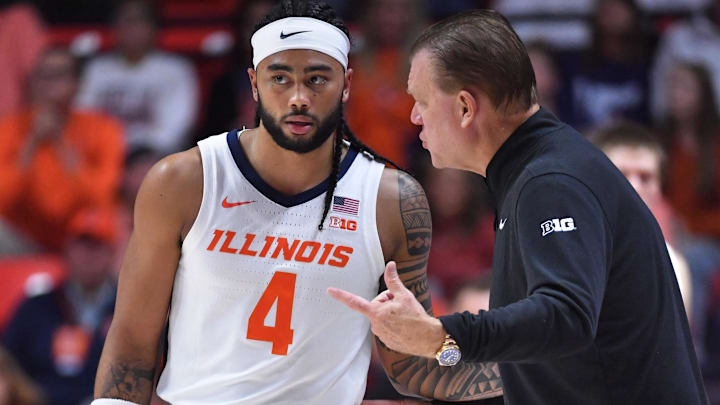 Nov 14, 2025; Champaign, Illinois, USA;  Illinois Fighting Illini head coach Brad Underwood talks with Kylan Boswell (4) during the first half against the Colgate Raiders  at State Farm Center. Mandatory Credit: Ron Johnson-Imagn Images
