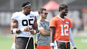 Cleveland Browns defensive end Myles Garrett talks to quarterback Shedeur Sanders during NFL training camp