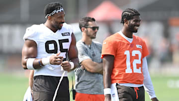 Cleveland Browns defensive end Myles Garrett talks to quarterback Shedeur Sanders during NFL training camp