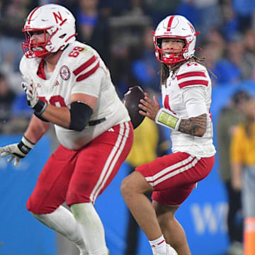 Nebraska Cornhuskers quarterback TJ Lateef (14) drops back to pass against the UCLA Bruins during the second half at the Rose Bowl.
