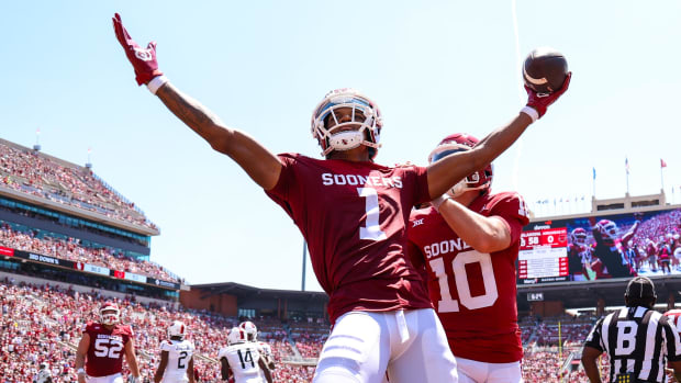 Oklahoma Sooners wide receiver Jayden Gibson celebrates a touchdown during a college football game.