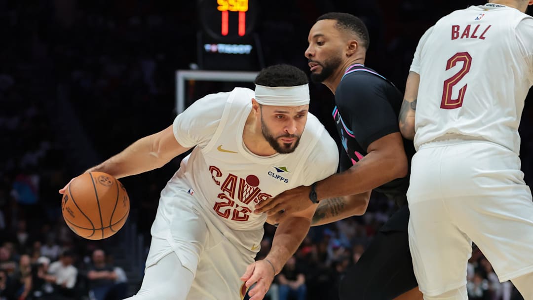 Nov 12, 2025; Miami, Florida, USA; Cleveland Cavaliers forward Larry Nance Jr. (22) drives to the basket against Miami Heat guard Norman Powell (24) during the second quarter at Kaseya Center. Mandatory Credit: Sam Navarro-Imagn Images