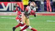 Feb 11, 2024; Paradise, Nevada, USA; Kansas City Chiefs safety Mike Edwards (21) tackles San Francisco 49ers wide receiver Brandon Aiyuk (11) during overtime of Super Bowl LVIII at Allegiant Stadium.