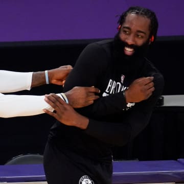 Feb 18, 2021; Los Angeles, California, USA; Los Angeles Lakers forward LeBron James (left) and Brooklyn Nets guard James Harden share a laugh before their game at Staples Center. Mandatory Credit: Robert Hanashiro-USA TODAY Sports