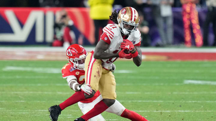 Feb 11, 2024; Paradise, Nevada, USA; Kansas City Chiefs safety Mike Edwards (21) tackles San Francisco 49ers wide receiver Brandon Aiyuk (11) during overtime of Super Bowl LVIII at Allegiant Stadium. Mandatory Credit: Kyle Terada-USA TODAY Sports