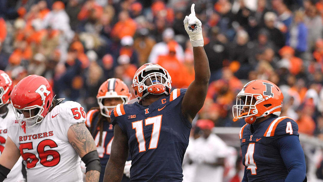 Nov 1, 2025; Champaign, Illinois, USA;  Illinois Fighting Illini linebacker Gabe Jacas (17) celebrates his sack on Rutgers Scarlet Knights quarterback Athan Kaliakmanis (16) during the first half at Memorial Stadium. Mandatory Credit: Ron Johnson-Imagn Images