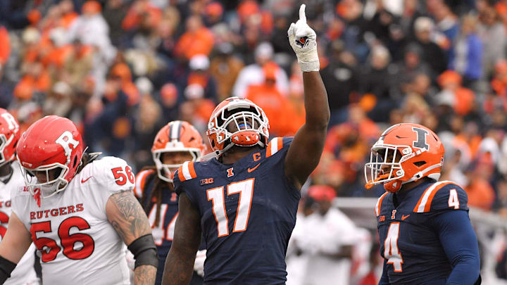 Nov 1, 2025; Champaign, Illinois, USA;  Illinois Fighting Illini linebacker Gabe Jacas (17) celebrates his sack on Rutgers Scarlet Knights quarterback Athan Kaliakmanis (16) during the first half at Memorial Stadium. Mandatory Credit: Ron Johnson-Imagn Images