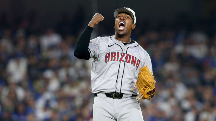 Jul 4, 2024; Los Angeles, California, USA; Arizona Diamondbacks pitcher Thyago Vieira (49) reacts after a strikeout to end the game against the Los Angeles Dodgers at Dodger Stadium. Mandatory Credit: Jason Parkhurst-USA TODAY Sports