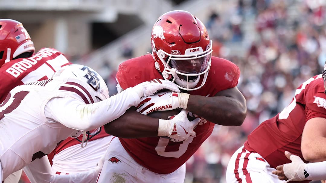 Arkansas Razorbacks running back Braylen Russell (0) rushes for a touchdown during the fourth quarter against the Mississippi State Bulldogs at Razorback Stadium.