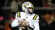 Saline dual-threat quarterback Tommy Carr looks to pass against Belleville during the first half of district final at Belleville High School on Friday, Nov. 8, 2024.