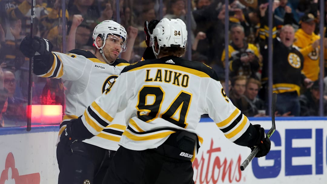 Mar 19, 2023; Buffalo, New York, USA;  Boston Bruins right wing Garnet Hathaway (21) celebrates his goal with center Jakub Lauko (94) during the first period against the Buffalo Sabres at KeyBank Center. Mandatory Credit: Timothy T. Ludwig-Imagn Images