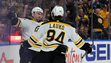 Mar 19, 2023; Buffalo, New York, USA;  Boston Bruins right wing Garnet Hathaway (21) celebrates his goal with center Jakub Lauko (94) during the first period against the Buffalo Sabres at KeyBank Center. Mandatory Credit: Timothy T. Ludwig-Imagn Images