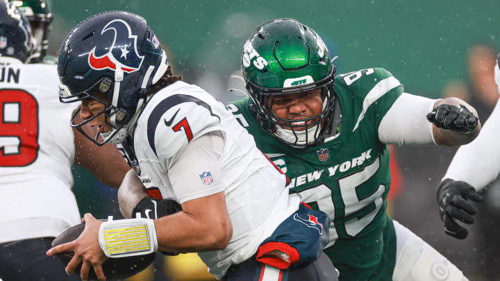 Dec 10, 2023; East Rutherford, NJ; Houston Texans quarterback C.J. Stroud (7) is sacked by New York Jets defensive tackle Quinnen Williams (95) during the second half at MetLife Stadium..