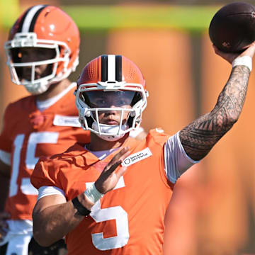 Jul 23, 2025; Berea, OH, USA; Cleveland Browns quarterback Dillon Gabriel (5) throws a pass as quarterback Joe Flacco (15) looks on during training camp at CrossCountry Mortgage Campus. Mandatory Credit: Ken Blaze-Imagn Images