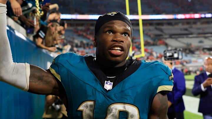 Jacksonville Jaguars wide receiver Travis Hunter (12) high-fives fans after the game of an NFL football matchup at EverBank Stadium, Monday, Oct. 6, 2025, in Jacksonville, Fla. The Jacksonville Jaguars edged the Kansas City Chiefs 31-28. [Corey Perrine/Florida Times-Union]