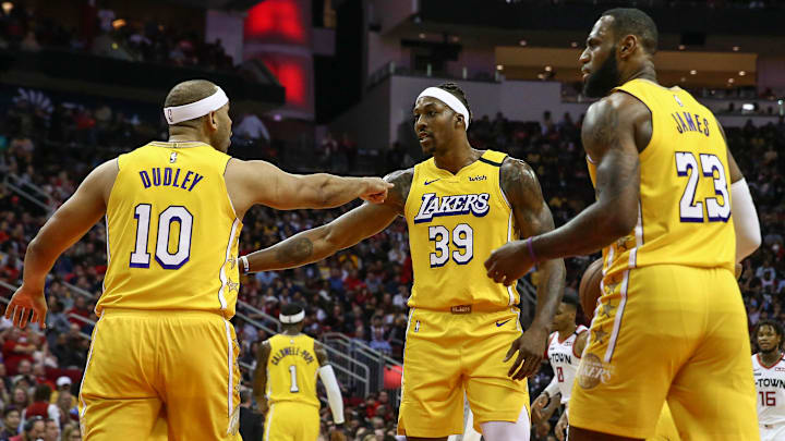 Former Los Angeles Lakers forward Jared Dudley (10), center Dwight Howard (39), and forward LeBron James (23) react during the game against the Houston Rockets at Toyota Center.