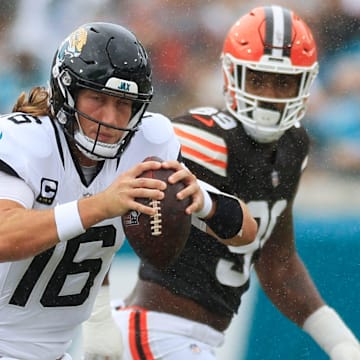 Jacksonville Jaguars quarterback Trevor Lawrence (16) is forced to run as Cleveland Browns defensive tackle Quinton Jefferson (72) pressures during the second quarter of an NFL football matchup Sunday, Sept. 15, 2024 at EverBank Stadium in Jacksonville, Fla. The Browns defeated the Jaguars 18-13. [Corey Perrine/Florida Times-Union]