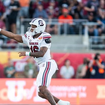 Dec 31, 2024; Orlando, FL, USA; South Carolina Gamecocks quarterback LaNorris Sellers (16) throws the ball against the Illinois Fighting Illini in the third quarter at Camping World Stadium. Mandatory Credit: Jeremy Reper-Imagn Images