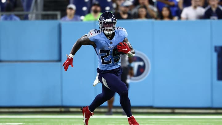 Aug 17, 2024; Nashville, Tennessee, USA; Tennessee Titans running back Hassan Haskins (25) runs the ball down the field in the fourth quarter of the game against the Seattle Seahawks at Nissan Stadium. Mandatory Credit: Casey Gower-USA TODAY Sports