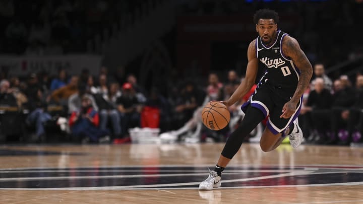 Mar 21, 2024; Washington, District of Columbia, USA;  Sacramento Kings guard Malik Monk (0) dribbles during the first half against the Washington Wizards at Capital One Arena. 