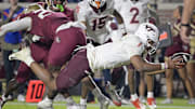 Nov 15, 2025; Tallahassee, Fla.; Virginia Tech quarterback Kyron Drones (1) dives for a touchdown against Florida State.