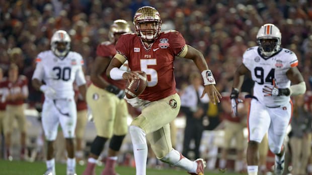 Florida State Seminoles quarterback Jameis Winston scrambles during the second half of the 2014 BCS National Championship.