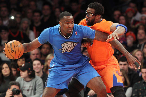 Dec 25, 2013; New York, NY, USA; Oklahoma City Thunder center Kendrick Perkins (5) controls the ball against New York Knicks power forward Amar'e Stoudemire (1) during the third quarter of a game at Madison Square Garden. The Thunder defeated the Knicks 123-94. Mandatory Credit: Brad Penner-USA TODAY Sports