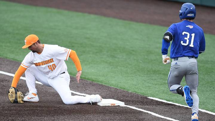 UNC Asheville's Dominic Freeberger is forced at first base by Tennessee's Luc Lipcius in the NCAA baseball game on Wednesday, February 26, 2020.

Kns Tn Unc Asheville