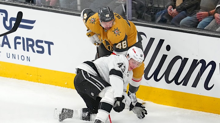 Feb 5, 2026; Las Vegas, Nevada, USA; Los Angeles Kings defenseman Jacob Moverare (43) attempts a hand pass in front of Vegas Golden Knights center Tomas Hertl (48) during the third period at T-Mobile Arena. Mandatory Credit: Stephen R. Sylvanie-Imagn Images