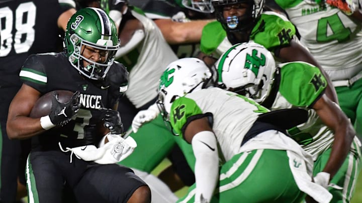Venice ball carrier Jamarice Wilder (#3) prepares to meet two Haines City defenders. The Venice Indians hosted the Haines City Hornets in the Class 7A-Region 2 quarterfinal Friday night, Nov. 15, 2024.