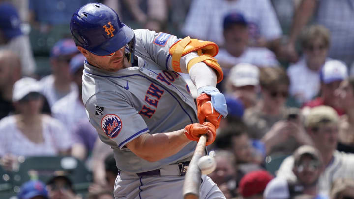 Jun 22, 2024; Chicago, Illinois, USA; New York Mets first baseman Pete Alonso (20) hits a single against the Chicago Cubs during the sixth inning at Wrigley Field.
