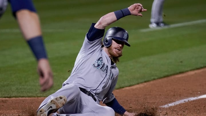 Seattle Mariners left fielder Ben Gamel slides home against the Oakland Athletics on Sept. 1, 2018 at the Oakland Coliseum.