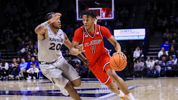 Jan 7, 2025; Cincinnati, Ohio, USA; St. John's basketball guard Simeon Wilcher (7) dribbles against Xavier Musketeers guard Dayvion McKnight (20) in the second half at Cintas Center.