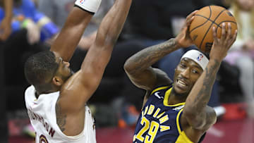 Apr 13, 2025; Cleveland, Ohio, USA; Indiana Pacers guard Quenton Jackson (29) looks to pass beside Cleveland Cavaliers center Tristan Thompson (13) in the third quarter at Rocket Arena. Mandatory Credit: David Richard-Imagn Images