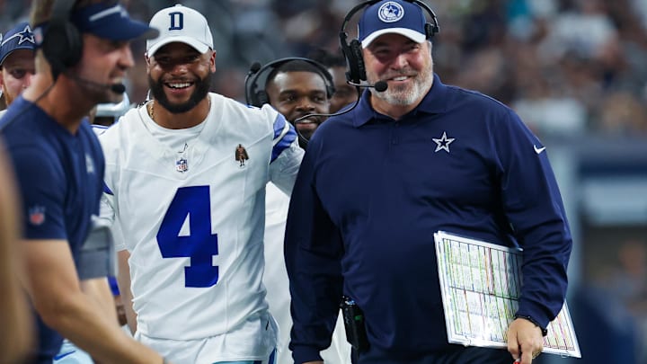 Dallas Cowboys head coach Mike McCarthy laughs with Dallas Cowboys quarterback Dak Prescott (4) after a touchdown during the second quarter against the Jacksonville Jaguars.