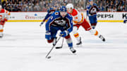 Nov 25, 2023; Denver, Colorado, USA; Colorado Avalanche center Ryan Johansen (12) chases down a loose puck in the second period against the Calgary Flames at Ball Arena. Mandatory Credit: Isaiah J. Downing-Imagn Images