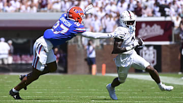 Sep 21, 2024; Starkville, Mississippi, USA; Mississippi State Bulldogs wide receiver Kevin Coleman Jr. (3) runs the ball against Florida Gators defensive back Dijon Johnson (27) during the second quarter at Davis Wade Stadium at Scott Field. Mandatory Credit: Matt Bush-Imagn Images