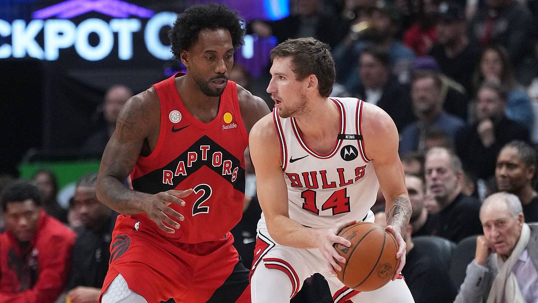 Oct 21, 2026; Toronto, Ontario, CAN;  Chicago Bulls forward Matas Buzelis (14) controls the ball against Toronto Raptors forward Kawhi Leonard (2) during the second quarter at Scotiabank Arena.  Mandatory Credit: Nick Turchiaro-Imagn Images