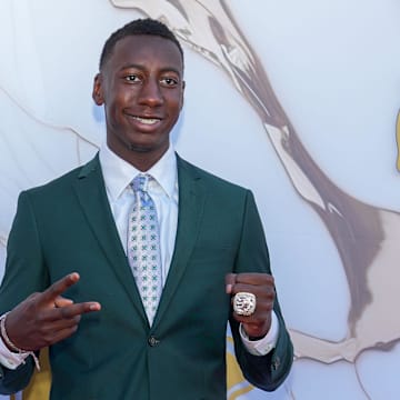 Kansas City Chiefs cornerback Joshua Williams poses for a photo on the red carpet at the Nelson-Akins Museum of Art.