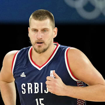 Aug 10, 2024; Paris, France; Serbia power forward Nikola Jokic (15) runs up the court against Germany in the men's basketball bronze medal game during the Paris 2024 Olympic Summer Games at Accor Arena. Mandatory Credit: Kyle Terada-Imagn Images