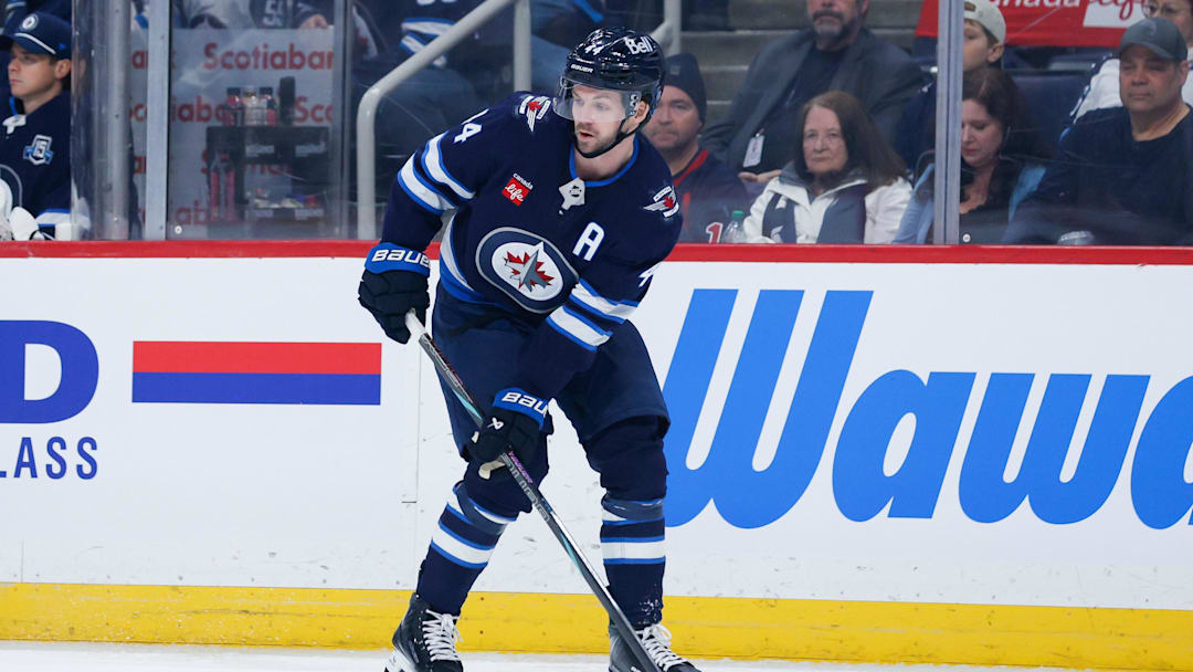 Winnipeg Jets defenceman Josh Morrissey (44) looks to make a pass against the Vancouver Canucks during the first period at Canada Life Centre. 