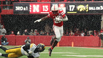 Nebraska running back Emmett Johnson rushes for 12 yards on third-and-1 during the second quarter against Iowa.