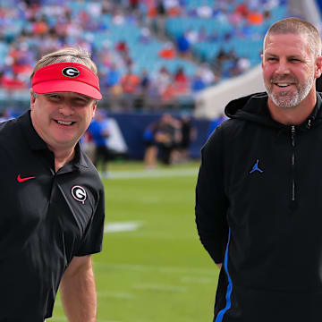 Georgia Bulldogs head coach Kirby Smart and former Florida Gators head coach Billy Napier previously coached together at Alabama.