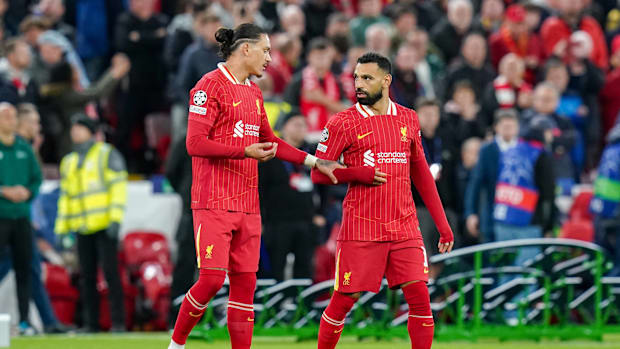 Darwin Nunez and Mohamed Salah talk together and gesture during the Liverpool vs Bologna UEFA Champions League game 