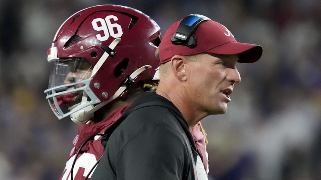 Alabama head coach Kalen DeBoer goes out to congratulate players coming off the field as Alabama defensive lineman Tim Keenan III (96) Alabama head coach Kalen DeBoer goes out to congratulate players coming off the field as Alabama defensive lineman Tim Keenan III (96)