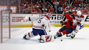 Apr 23, 2025; Washington, District of Columbia, USA; Montreal Canadiens goaltender Sam Montembeault (35) makes a save on Washington Capitals left wing Andrew Mangiapane (88) as Canadiens defenseman Alexandre Carrier (45) defends in the third period in game two of the first round of the 2025 Stanley Cup Playoffs at Capital One Arena. Mandatory Credit: Geoff Burke-Imagn Images